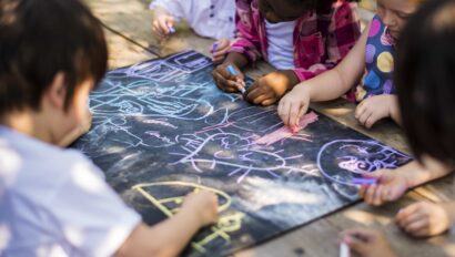 Kids drawing with chalk.